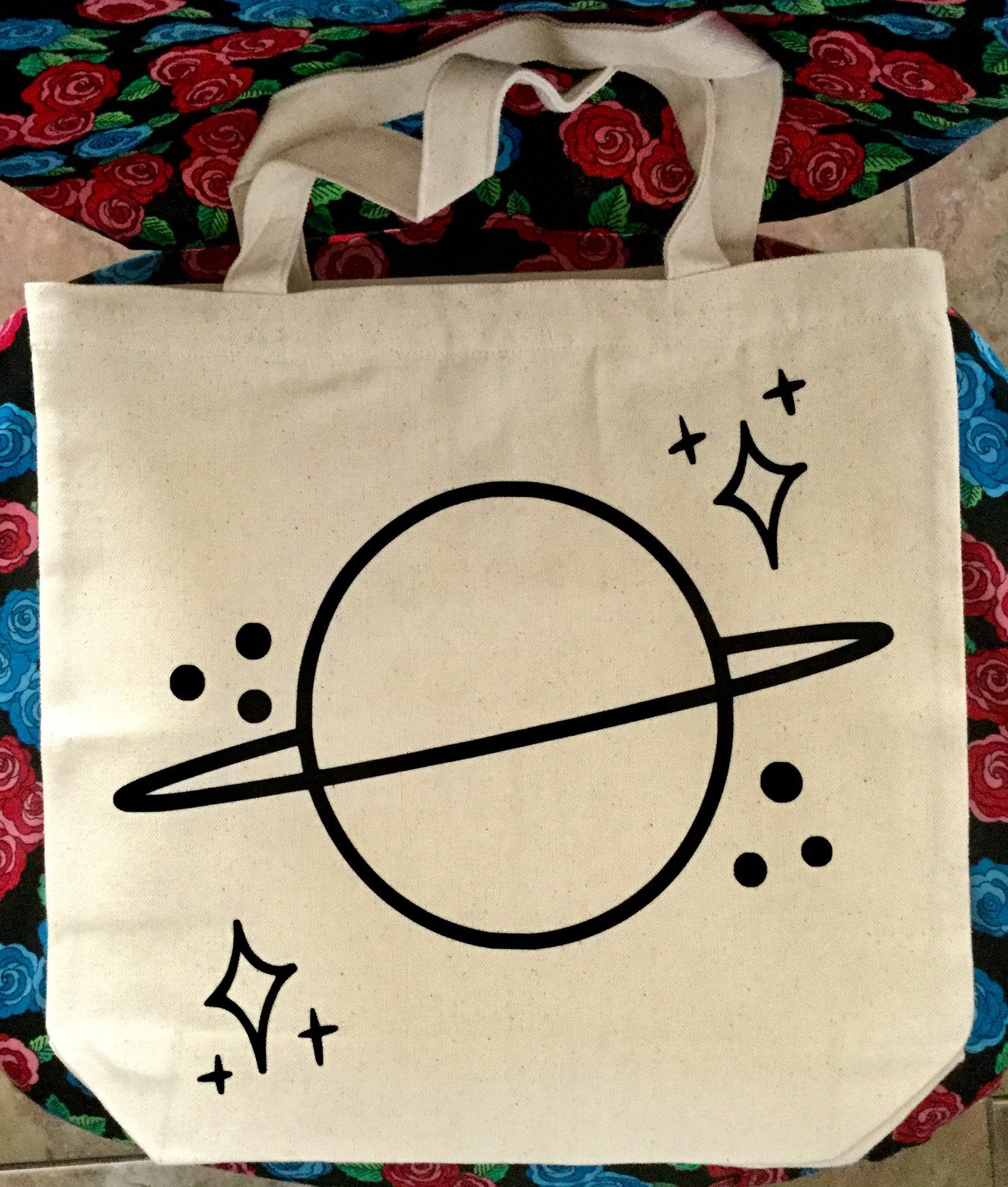 Bolso de mano con el planeta Saturno