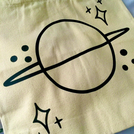 Bolso de mano con el planeta Saturno